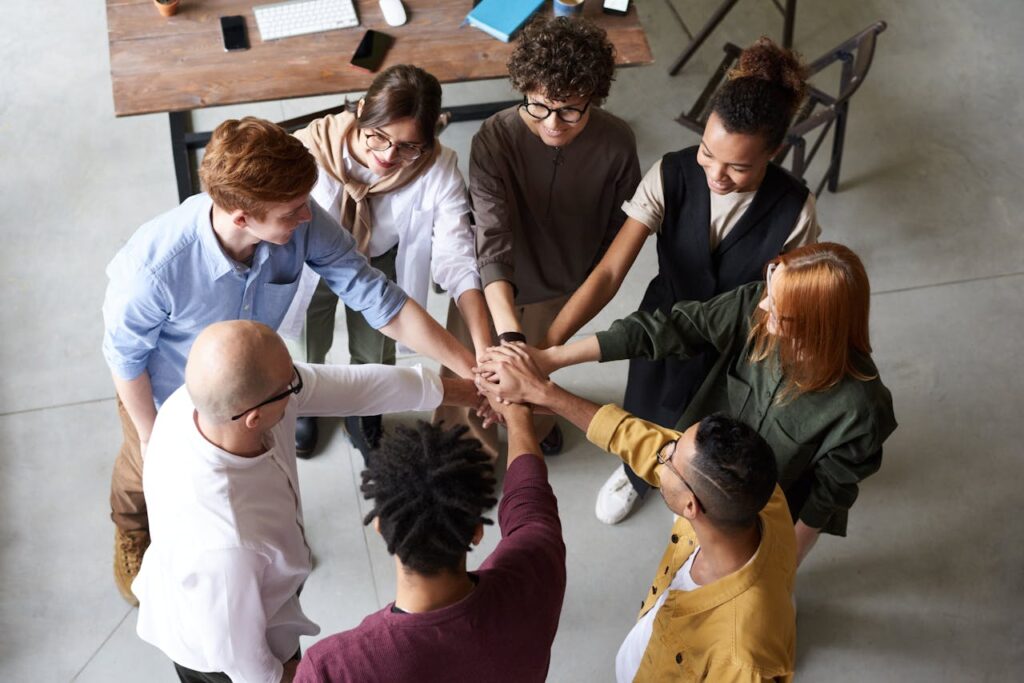 Top view of diverse group of people collaborating in office setting.